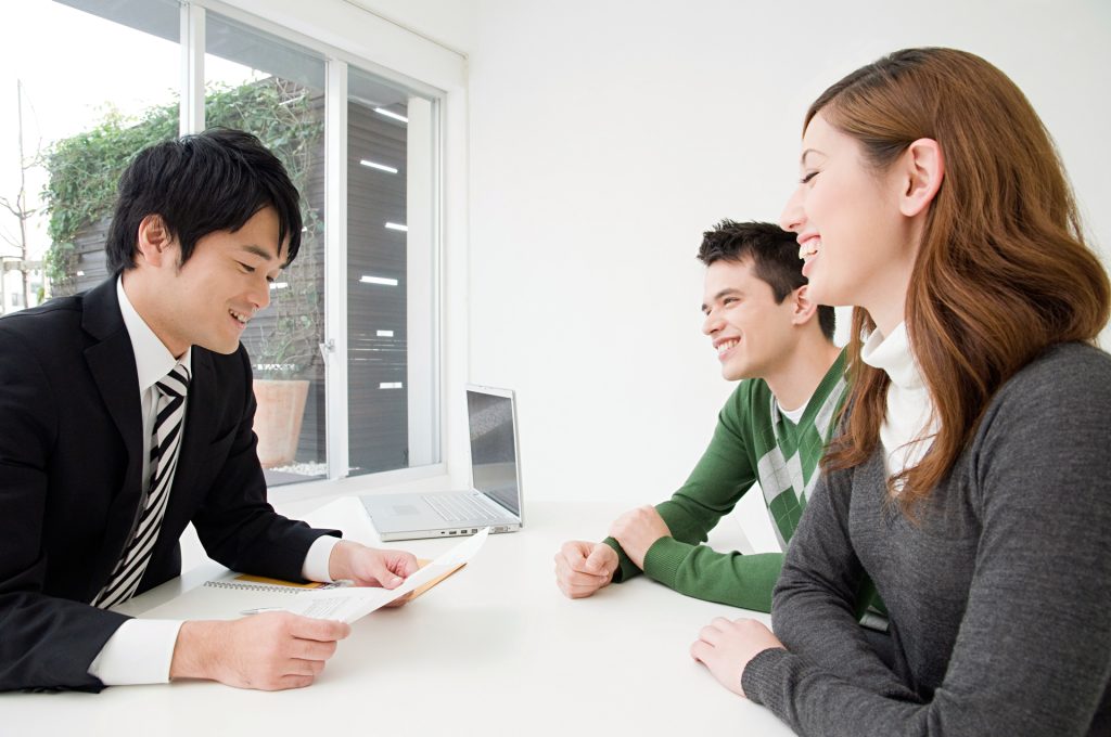 Professional team discussing and comparing pricing plans for flexible workspaces in Vietnam